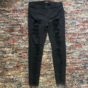 Mid rise black ripped jeans